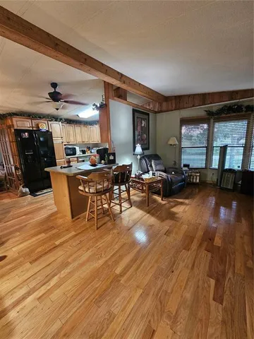 a bedroom with bed and a chandelier