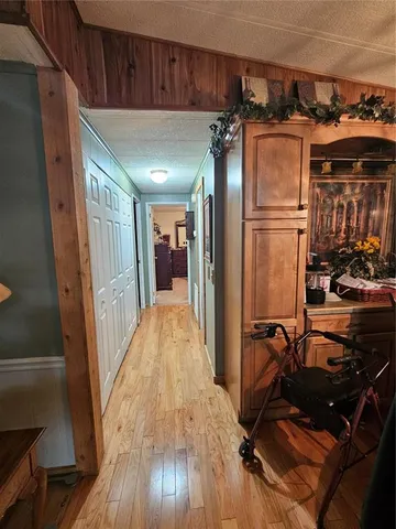 a bedroom with a bed a couch and dresser