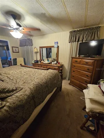 a view of a house with a yard porch and sitting area