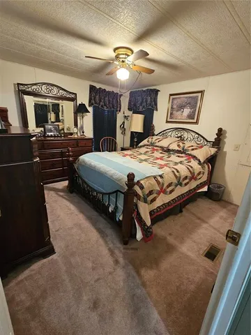 a view of a field with an trees