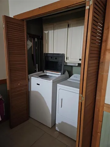 a outdoor dining area with chairs and table
