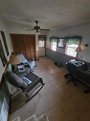 a kitchen with granite countertop a stove and a wooden floor