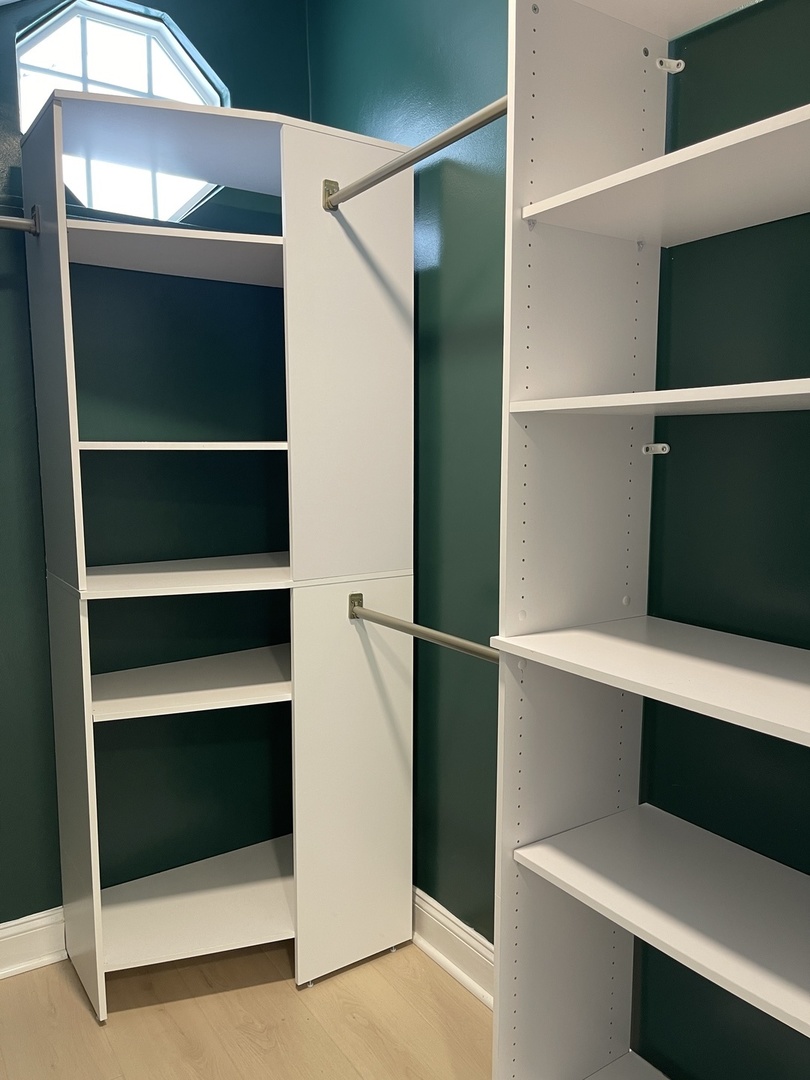 607 West Olive Street Bloomington, IL 61701 - Photo 11 of 17 a view of walk in closet with empty racks