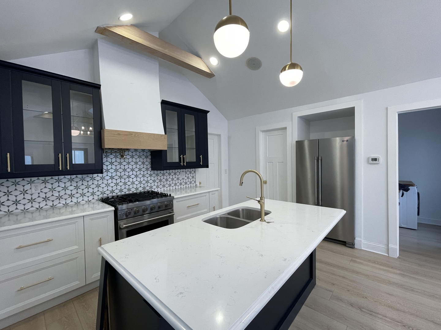 607 West Olive Street Bloomington, IL 61701 - Photo 2 of 17 a kitchen with a table chairs and a refrigerator