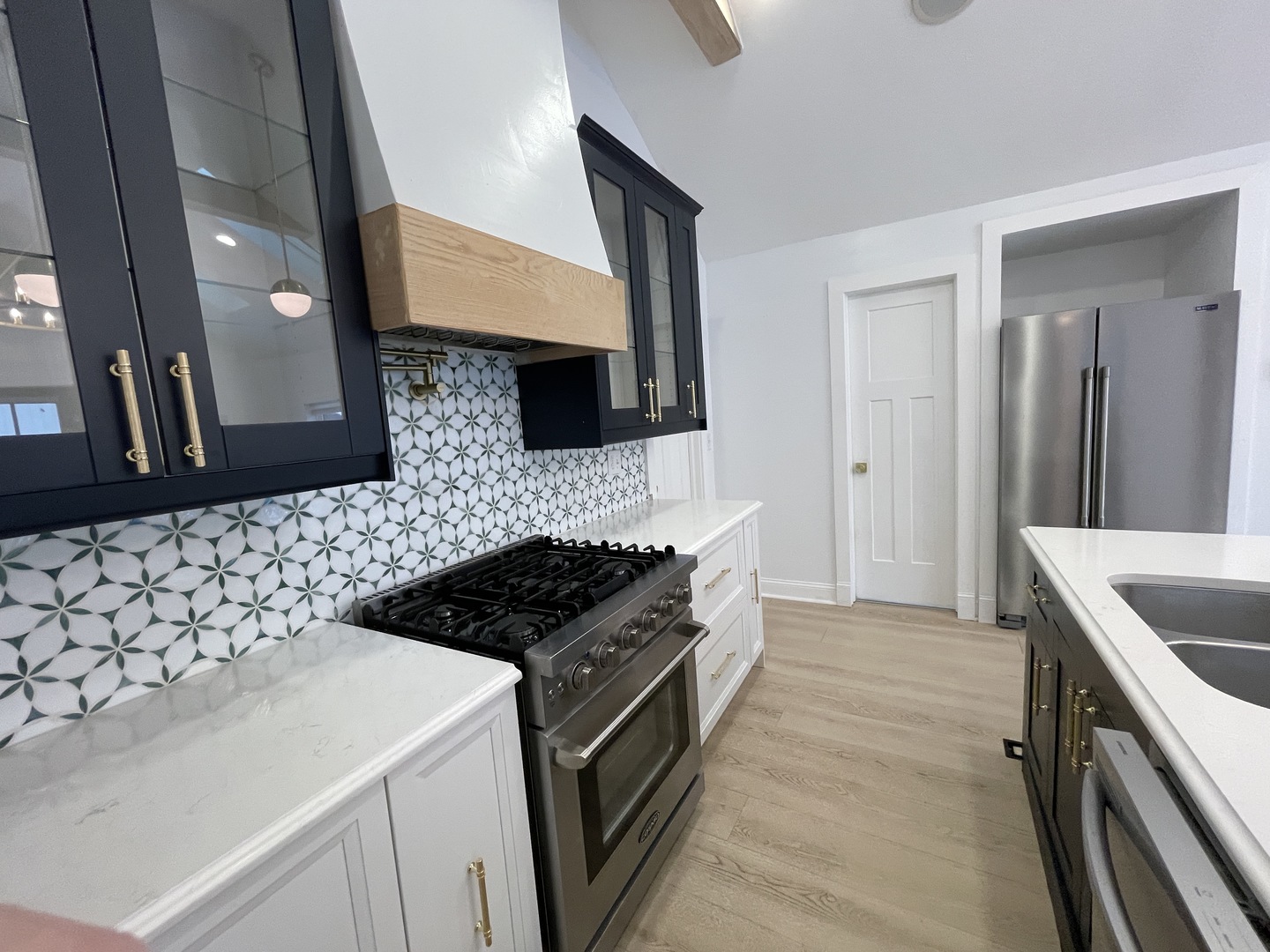 607 West Olive Street Bloomington, IL 61701 - Photo 4 of 17 a kitchen with a sink stove and cabinets