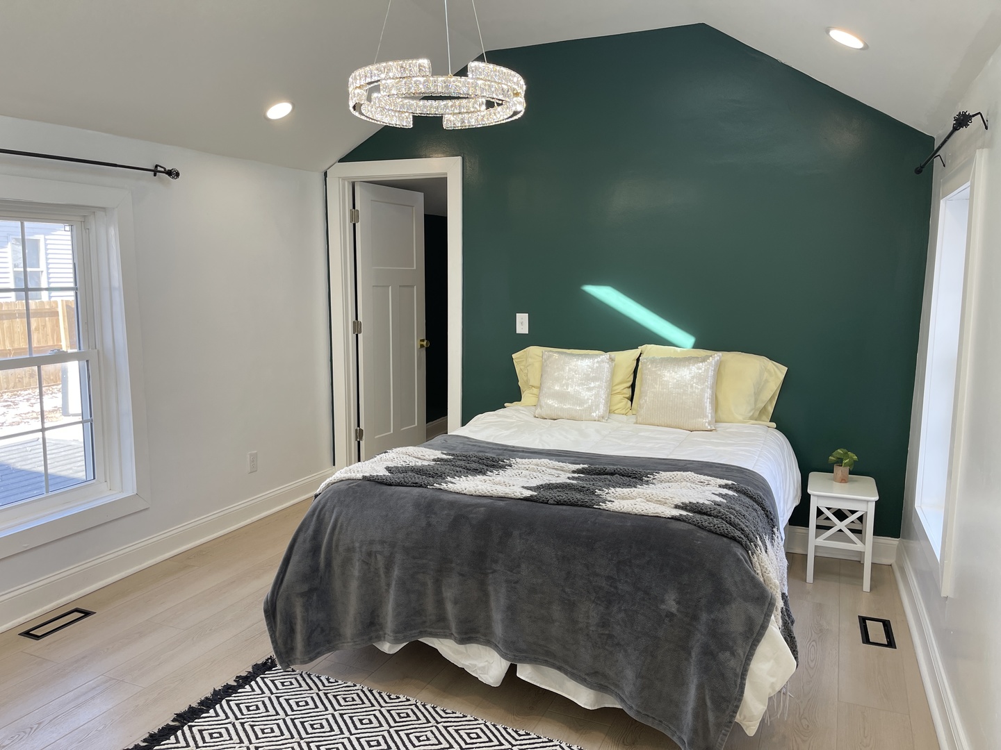 607 West Olive Street Bloomington, IL 61701 - Photo 6 of 21 a bedroom with a bed chandelier and a window