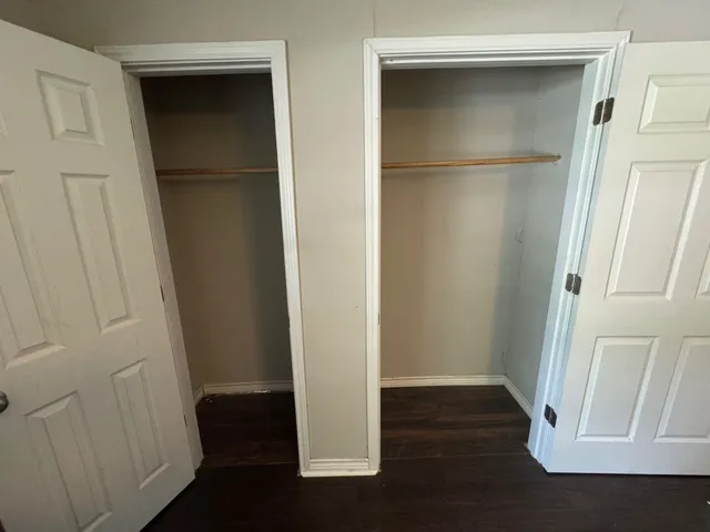a view of front door with wooden floor