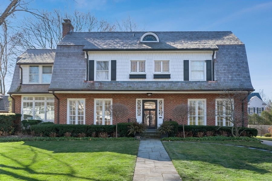 234 Raleigh Road Kenilworth, IL 60043 - Photo 1 of 29 a front view of a house with garden