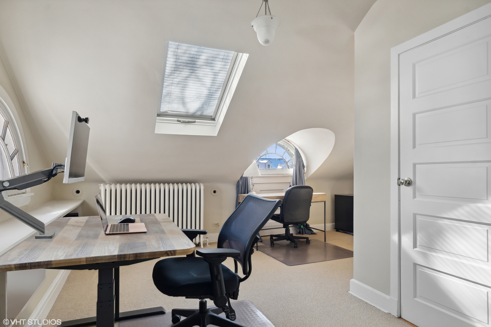234 Raleigh Road Kenilworth, IL 60043 - Photo 24 of 29 a view of a workspace with furniture and a window