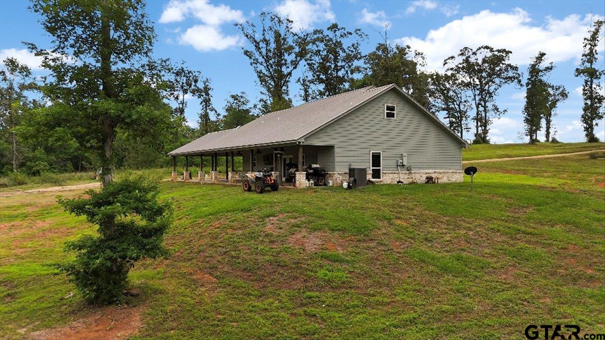 9235 Farm To Market Road 851 Rusk, TX 75785 - Photo 40 of 47 a front view of a house with garden