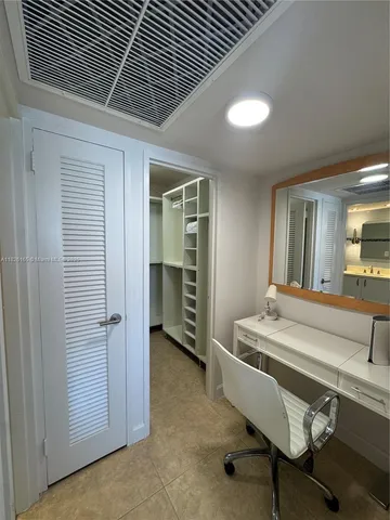 a bedroom with two beds and a window