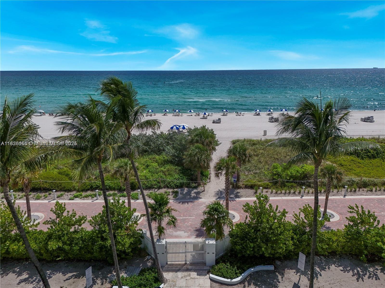 5151 Collins Avenue, Unit 535 Miami Beach, FL 33140 - Photo 2 of 34 an aerial view of a house with a yard