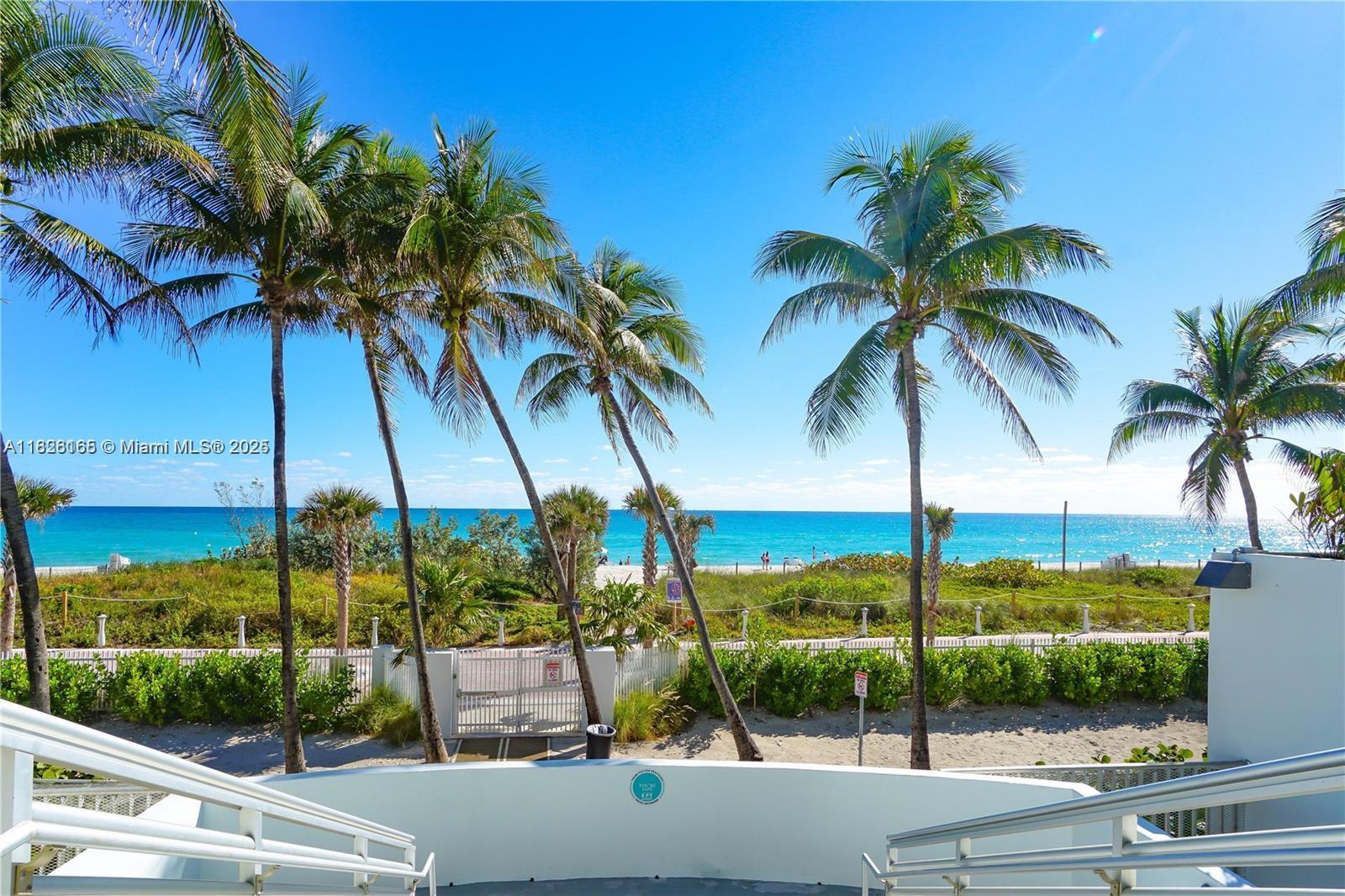 5151 Collins Avenue, Unit 535 Miami Beach, FL 33140 - Photo 25 of 34 a view of ocean with a palm tree
