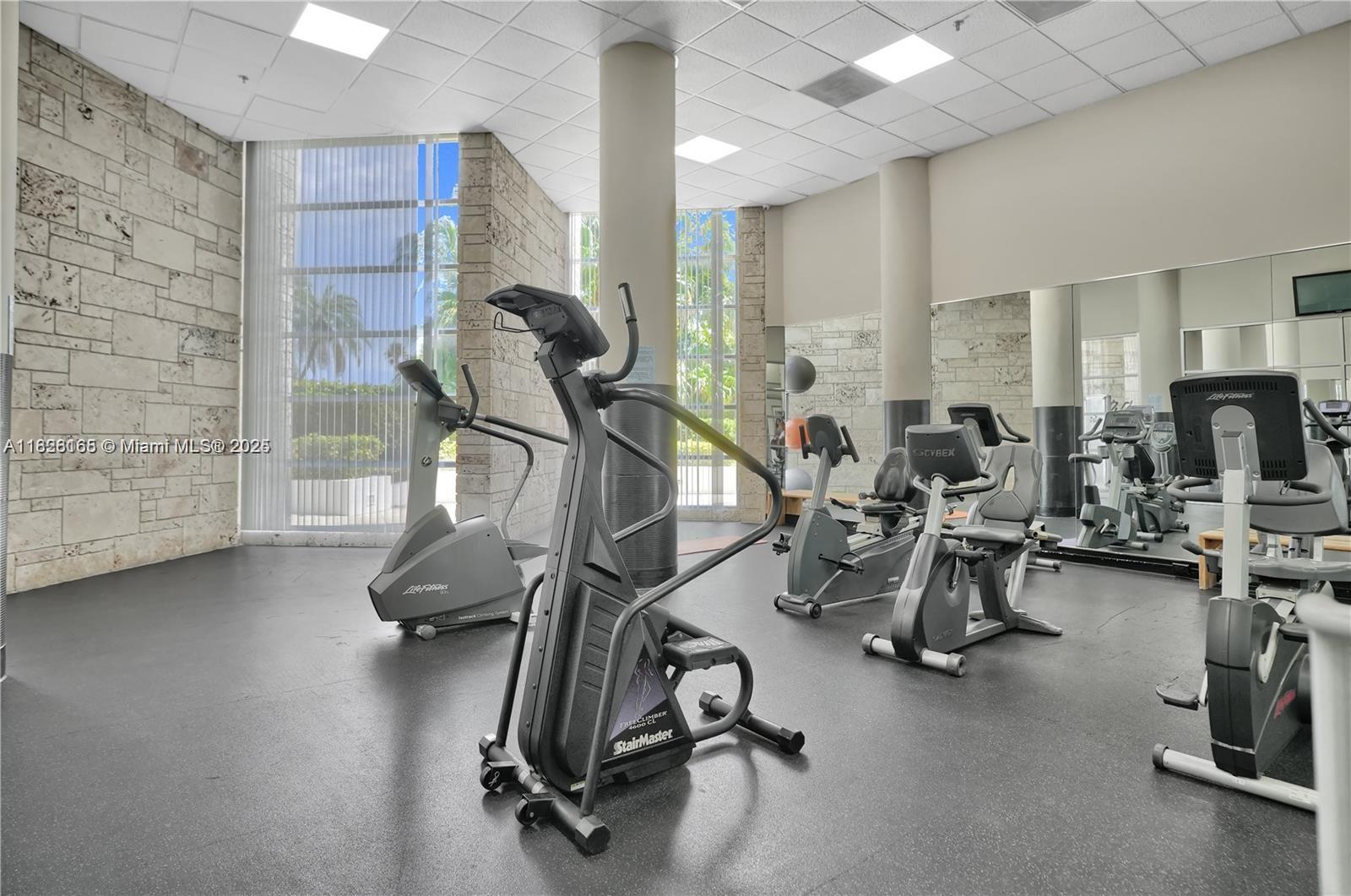 5151 Collins Avenue, Unit 535 Miami Beach, FL 33140 - Photo 31 of 34 a view of a room with gym equipment