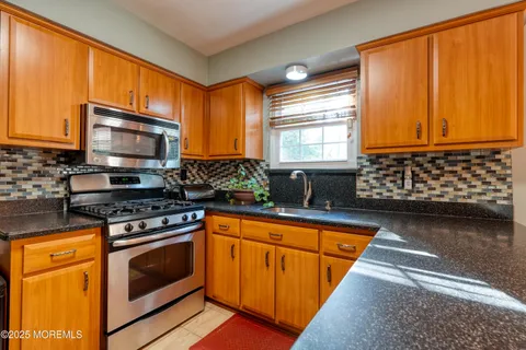 a view of a kitchen with a sink