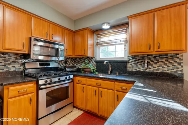 a view of a kitchen with a sink