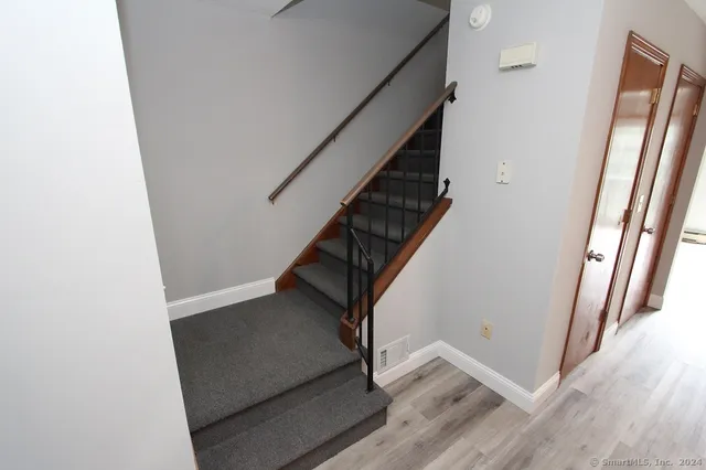 a view of entryway with wooden floor