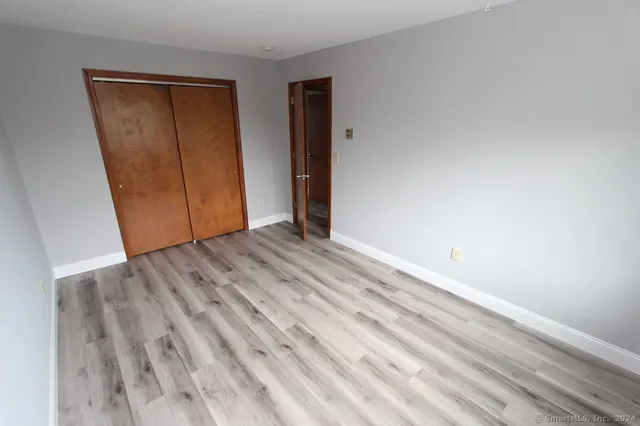 a view of a room with wooden walls