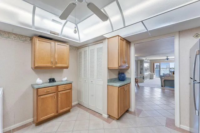 a bedroom with a bed chair and window