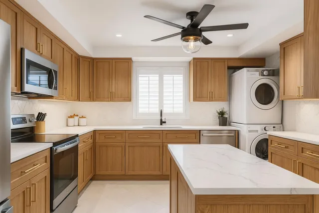 a kitchen that has a sink a stove top oven and cabinets