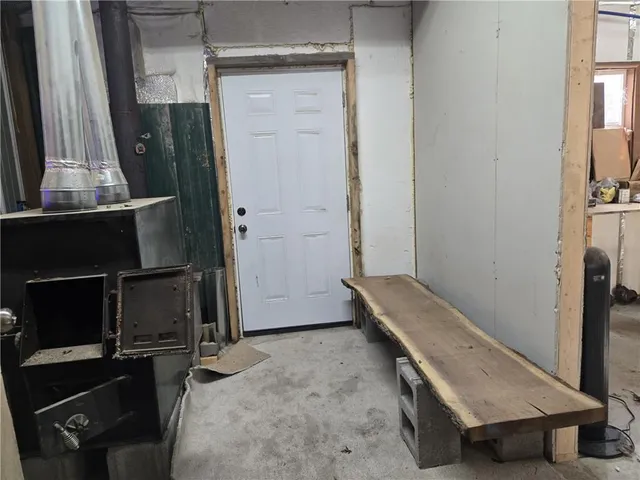 a room with a wooden floor and a glass door