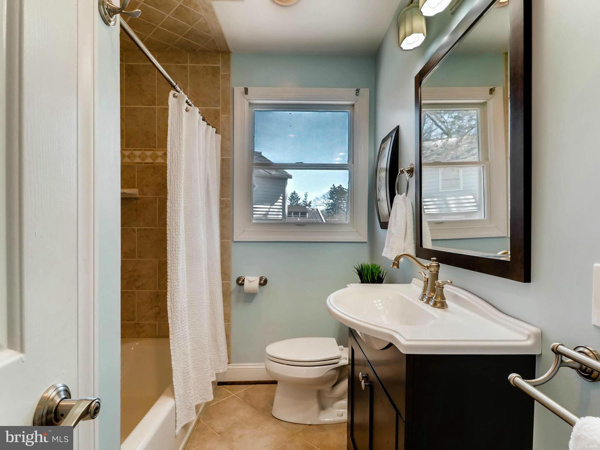 173 Copper Road Severna Park, MD 21146 - Photo 16 of 29 a bathroom with a sink a toilet and a mirror