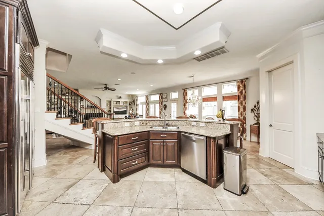 a stove top oven sitting inside of a kitchen