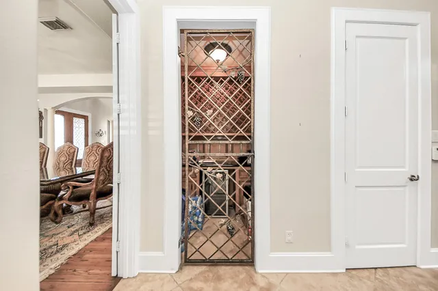 a living room with furniture a fireplace and a chandelier