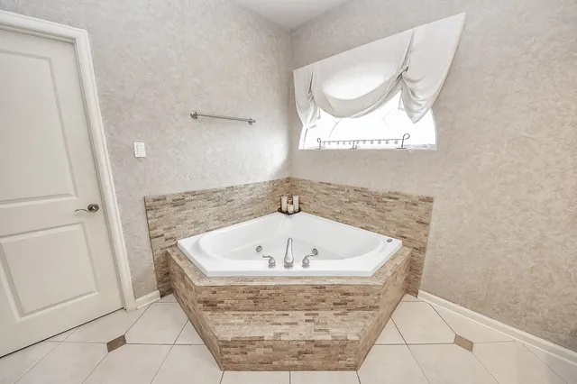 a bathroom with a sink a large mirror and a shower