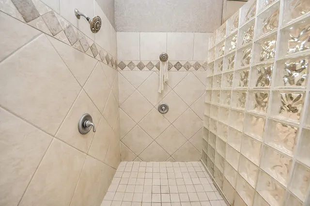 a view of an house with backyard space and balcony