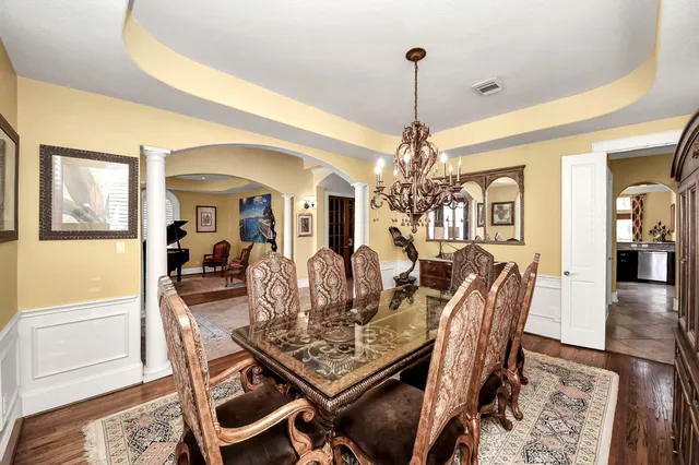 a kitchen with stainless steel appliances granite countertop a stove and cabinets