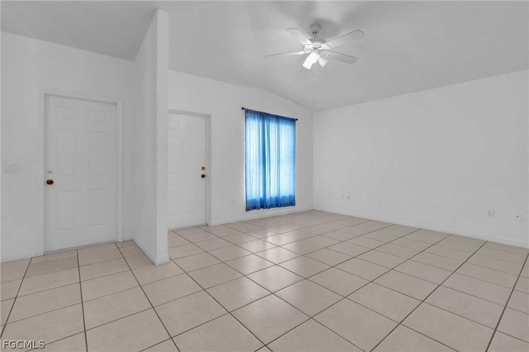 4716-4718 21st Street Southwest Lehigh Acres, FL 33973 - Photo 12 of 21 a view of an empty room with a window