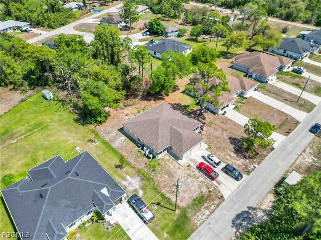4716-4718 21st Street Southwest Lehigh Acres, FL 33973 - Photo 18 of 21 an aerial view of house with yard
