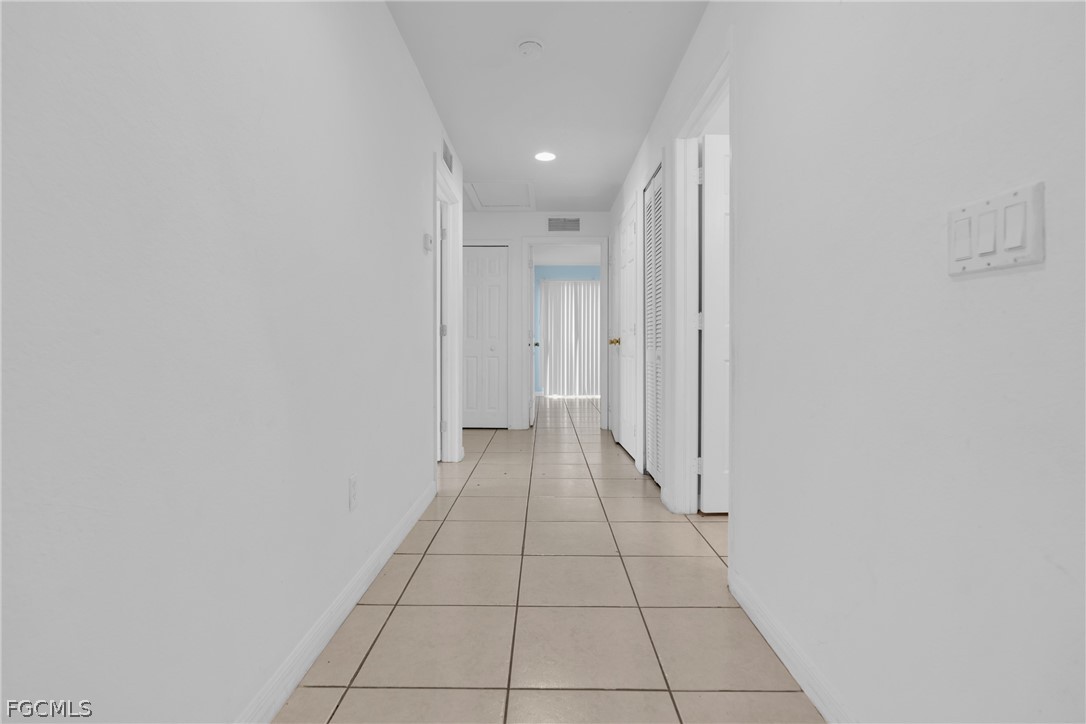 4716-4718 21st Street Southwest Lehigh Acres, FL 33973 - Photo 4 of 21 a view of a hallway with a white walls