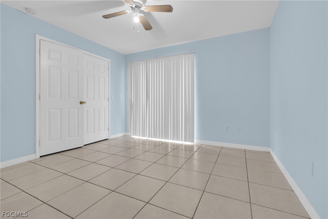 4716-4718 21st Street Southwest Lehigh Acres, FL 33973 - Photo 5 of 21 a view of an empty room and chandelier fan