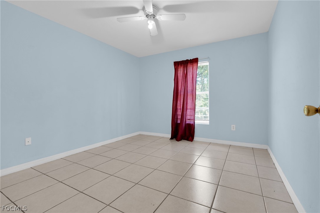 4716-4718 21st Street Southwest Lehigh Acres, FL 33973 - Photo 7 of 21 a view of an empty room and window