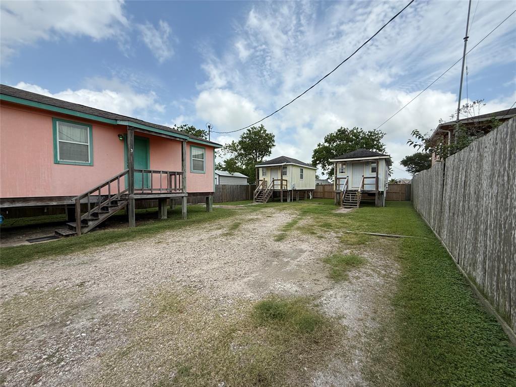 613 24th Street, Unit A Dickinson, TX 77539 - Photo 1 of 15 a view of a house with backyard and sitting area