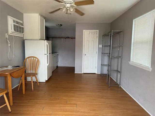 a view of kitchen with furniture and wooden floor