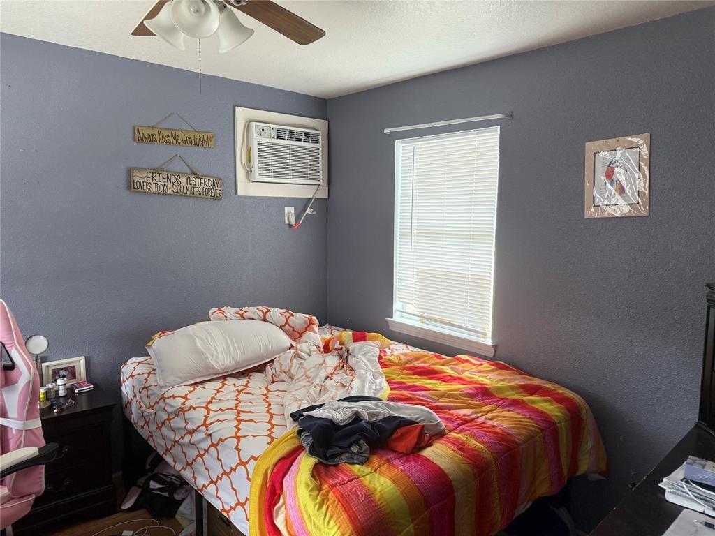 613 24th Street, Unit A Dickinson, TX 77539 - Photo 12 of 15 a bedroom with bed and a window