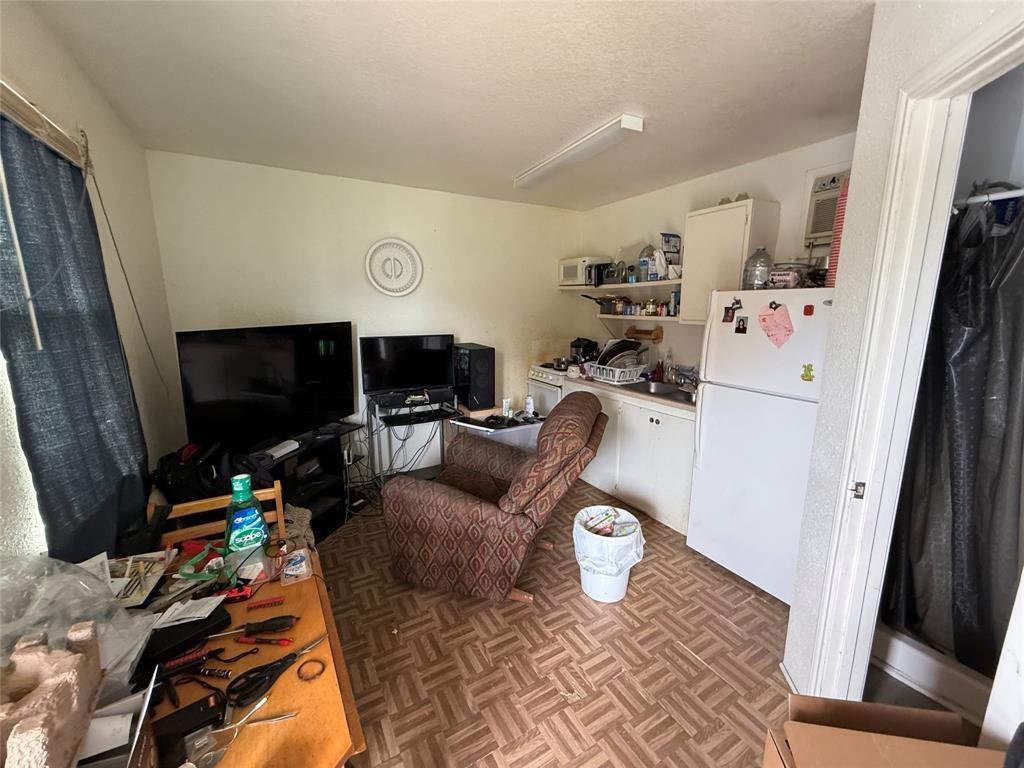 613 24th Street, Unit A Dickinson, TX 77539 - Photo 15 of 15 a living room with furniture and a flat screen tv