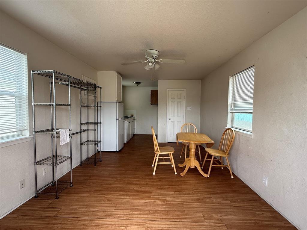 613 24th Street, Unit A Dickinson, TX 77539 - Photo 6 of 15 a view of a dining room with furniture and wooden floor