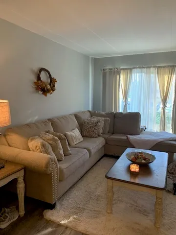 a living room with furniture and a table