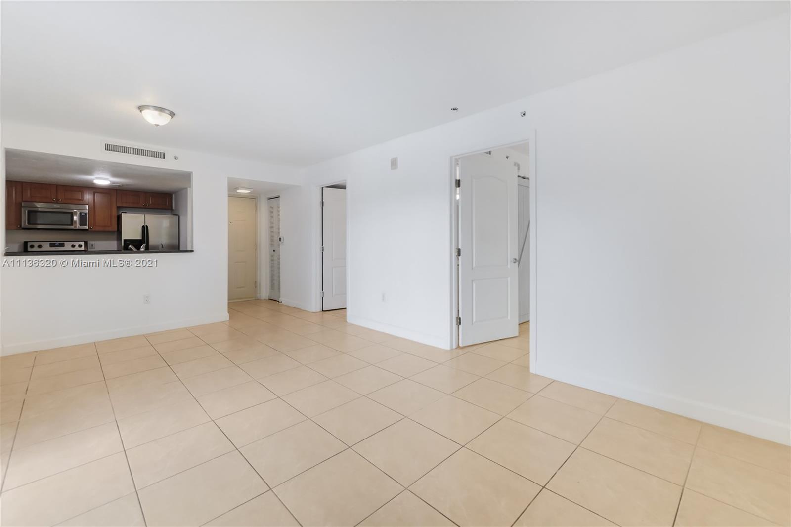 280 Southwest 20th Road, Unit 404 Miami, FL 33129 - Photo 5 of 52 a view of a livingroom and an empty room