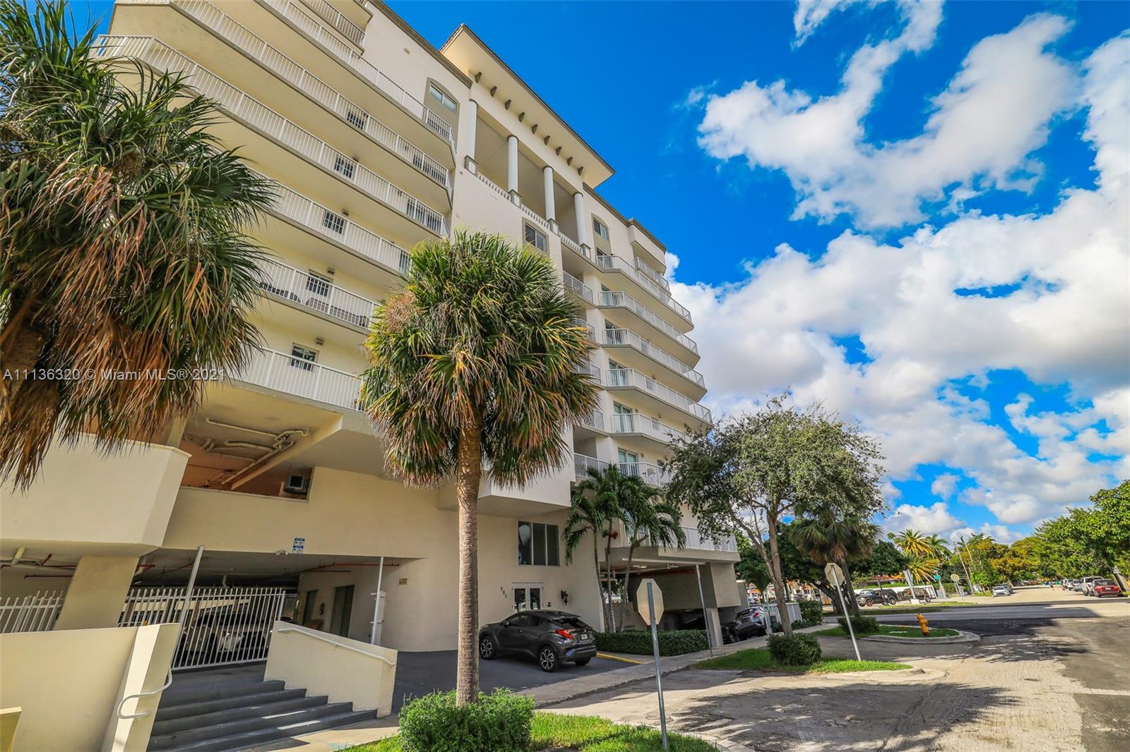 280 Southwest 20th Road, Unit 404 Miami, FL 33129 - Photo 43 of 52 a view of a palm trees in front of a building