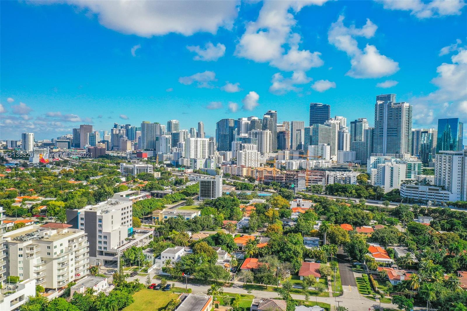 280 Southwest 20th Road, Unit 404 Miami, FL 33129 - Photo 50 of 52 a view of a city with lots of plants and trees in the background