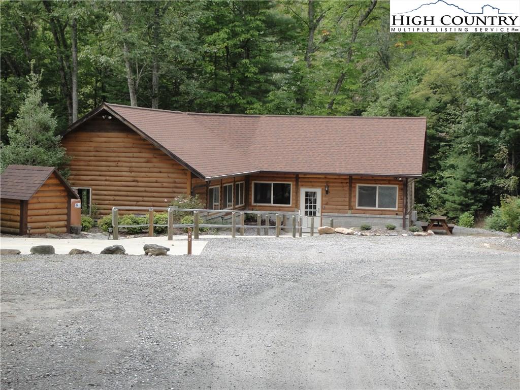 72-73 Buck Mountain Road Purlear, NC 28665 - Photo 27 of 47 a front view of a house with a yard