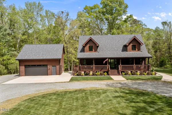 a front view of a house with a porch