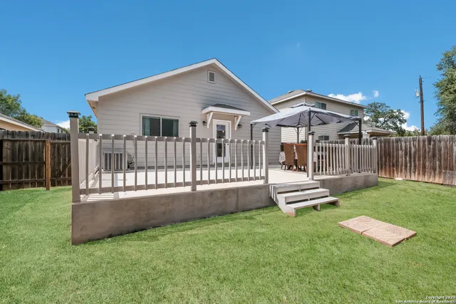 a picture of a bench in front of a wall