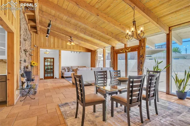 a bathroom with a granite countertop sink and a bathtub