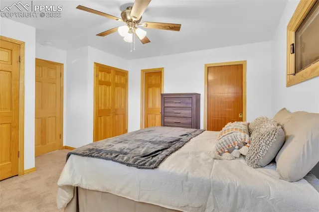 a view of a living room a rug and a couch